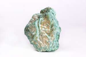 Closeup of a colourful mineral stone under the lights isolated on a white background